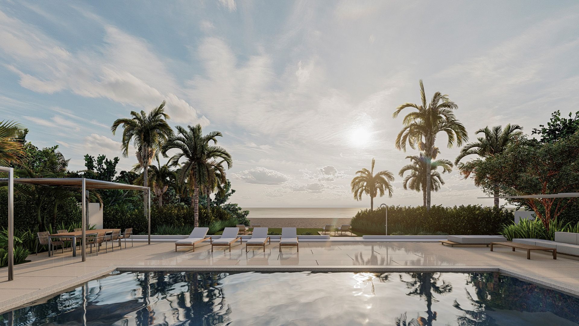 Residencia frente al mar — piscina con palmeras y vista al océano
